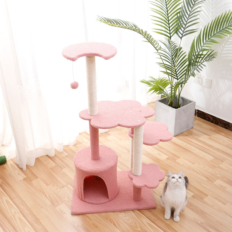 Cat scratching wooden house tree