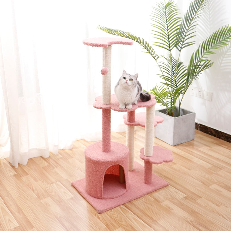 Cat scratching wooden house tree
