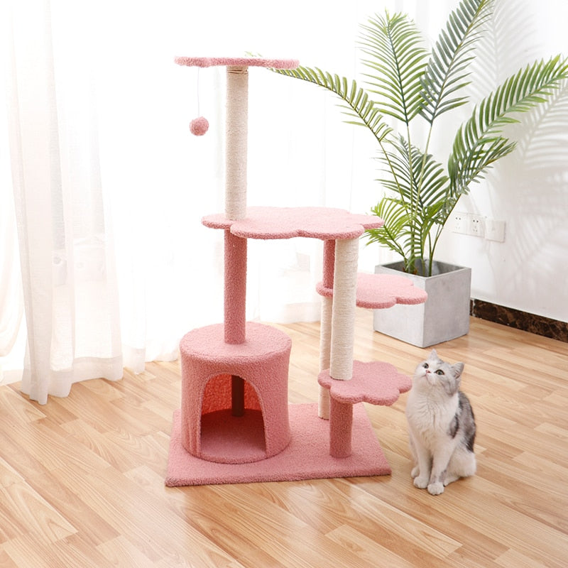 Cat scratching wooden house tree